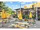 Charming outdoor seating area with yellow umbrellas and picnic tables at 509 Rankin Ne St, Atlanta, GA 30308