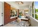 Inviting screened porch with brick accents, comfortable seating, stylish rug, and ample natural light at 509 Rankin Ne St, Atlanta, GA 30308
