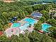 Aerial view of community pool, clubhouse, and lake in the background at 186 Sunshower Rdg, Canton, GA 30114
