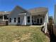 Charming home with a well-maintained lawn and covered porch in the backyard at 186 Sunshower Rdg, Canton, GA 30114