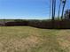 Expansive backyard featuring a lush lawn and sturdy wood fence for privacy at 186 Sunshower Rdg, Canton, GA 30114