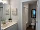 Clean bathroom featuring a single sink vanity and a toilet and shower combination at 186 Sunshower Rdg, Canton, GA 30114