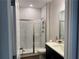 Bathroom featuring a glass enclosed shower with marble tile and a vanity with solid surface top at 186 Sunshower Rdg, Canton, GA 30114