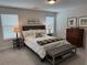 Comfortable bedroom with a wooden headboard, neutral colors, and ambient lighting for relaxation at 186 Sunshower Rdg, Canton, GA 30114