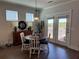Dining area with wood floors, modern chandelier, and view of the deck at 186 Sunshower Rdg, Canton, GA 30114
