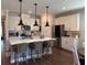 Modern kitchen with white cabinets, stainless steel appliances, and counter seating for three at 186 Sunshower Rdg, Canton, GA 30114
