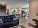 Bright living room with a kitchen island, breakfast table, and stairs in an open concept living space at 186 Sunshower Rdg, Canton, GA 30114