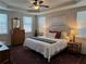 Calm main bedroom with neutral paint and a tray ceiling offers comfort and elegance at 186 Sunshower Rdg, Canton, GA 30114