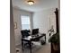 Bright office with neutral walls, carpet, desk, and view to a house plant at 186 Sunshower Rdg, Canton, GA 30114