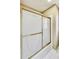 Bathroom shower featuring frosted glass doors and gold trim at 2119 Wrights Mill Ne Cir, Atlanta, GA 30324