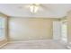 Bedroom featuring neutral carpet, a ceiling fan, and a window with blinds at 2119 Wrights Mill Ne Cir, Atlanta, GA 30324