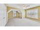 Bedroom featuring neutral carpet and two windows with blinds at 2119 Wrights Mill Ne Cir, Atlanta, GA 30324