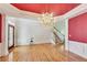 Elegant dining room with a crystal chandelier, hardwood floors, and decorative trim at 2119 Wrights Mill Ne Cir, Atlanta, GA 30324