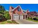 Beautiful brick home featuring a two-car garage and landscaped yard at 2119 Wrights Mill Ne Cir, Atlanta, GA 30324