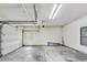 Spacious garage with concrete floor and overhead storage racks at 2119 Wrights Mill Ne Cir, Atlanta, GA 30324