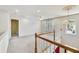 Upstairs landing with views of the staircase, a chandelier, and a sun-filled window at 2119 Wrights Mill Ne Cir, Atlanta, GA 30324