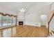 Bright living room featuring a fireplace, large windows, and hardwood floors at 2119 Wrights Mill Ne Cir, Atlanta, GA 30324
