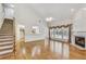 Bright living room with a fireplace, hardwood floors, and staircase at 2119 Wrights Mill Ne Cir, Atlanta, GA 30324