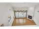 Bright living room with hardwood floors, fireplace, and large windows with shutters at 2119 Wrights Mill Ne Cir, Atlanta, GA 30324
