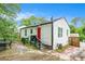 Backyard of home features a red entry door, steps, and foliage at 248 Upshaw Sw St, Atlanta, GA 30315