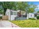 Street view of the house with red front door and landscaped yard at 248 Upshaw Sw St, Atlanta, GA 30315