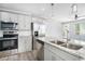 Kitchen featuring stainless appliances, granite countertops, and a double sink at 248 Upshaw Sw St, Atlanta, GA 30315