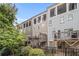 Exterior of townhomes with multiple decks and patios overlooking landscaped backyard at 289 Heritage Se Ln, Atlanta, GA 30316
