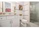 Clean bathroom with tile shower, framed mirror, modern fixtures, and white cabinets at 289 Heritage Se Ln, Atlanta, GA 30316