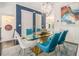 Elegant dining room features modern chandelier, contemporary art, and seating for six at 289 Heritage Se Ln, Atlanta, GA 30316