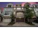 Attractive townhome exterior with an attached garage and small trees at 289 Heritage Se Ln, Atlanta, GA 30316