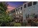 View of the rear patios and balconies of townhomes with varied neutral color schemes and black iron decorative fencing at 289 Heritage Se Ln, Atlanta, GA 30316