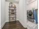 Well-organized laundry room with front-load washer and dryer, stylish shelving, and clean finishes at 289 Heritage Se Ln, Atlanta, GA 30316