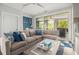 Comfortable living room with a large sectional sofa and access to the outdoor patio at 289 Heritage Se Ln, Atlanta, GA 30316