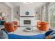 Stylish living room with a modern fireplace, built-in shelving, and colorful decor at 289 Heritage Se Ln, Atlanta, GA 30316