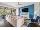 Open living room with outdoor patio access, plush seating, and ceiling fan at 289 Heritage Se Ln, Atlanta, GA 30316