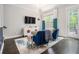 Cozy living room with stylish furniture, large window, and access to outdoor deck at 289 Heritage Se Ln, Atlanta, GA 30316
