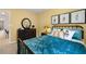 Comfortable bedroom with blue bedding, modern decor, and bright window at 309 Elgin Dr # 155, Lawrenceville, GA 30045