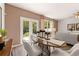Bright dining area features stylish decor, a modern table set, and French doors to bring the outdoors in at 309 Elgin Dr # 155, Lawrenceville, GA 30045