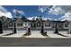 Charming two-story townhomes featuring a mix of siding and stone accents, complemented by white garage doors and well-maintained landscaping at 309 Elgin Dr # 155, Lawrenceville, GA 30045