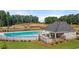 Community pool and outdoor pavilion with lush landscaping and mature trees at 309 Elgin Dr # 155, Lawrenceville, GA 30045