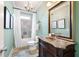 Elegant bathroom with marble countertop, decorative mirror, and a shower with stylish tile at 3309 Nw Past Nw Pl, Kennesaw, GA 30152