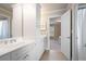 Bright bathroom with double vanity, white cabinetry, and tiled floors offers a clean and modern design at 3309 Nw Past Nw Pl, Kennesaw, GA 30152