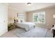 Cozy bedroom with neutral tones, large window, and plush carpeting for ultimate comfort at 3309 Nw Past Nw Pl, Kennesaw, GA 30152