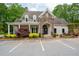 Community clubhouse with stone accents, ample parking, and meticulously maintained landscaping at 3309 Nw Past Nw Pl, Kennesaw, GA 30152