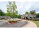 Community clubhouse featuring a picnic area, tennis court, sidewalks, and lush greenery at 3309 Nw Past Nw Pl, Kennesaw, GA 30152