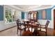 Elegant dining room with tray ceiling, large windows, and stylish furnishings at 3309 Nw Past Nw Pl, Kennesaw, GA 30152
