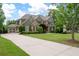 Beautiful home with a lush lawn, long driveway, and attached garage, perfect for Gathering living at 3309 Nw Past Nw Pl, Kennesaw, GA 30152
