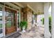 Cozy front porch featuring stone floors, comfortable rocking chairs, and a stylish wooden front door at 3309 Nw Past Nw Pl, Kennesaw, GA 30152