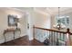 Elegant hallway with decorative chandelier and wrought iron railing leads to the upper level at 3309 Nw Past Nw Pl, Kennesaw, GA 30152