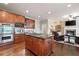 Gourmet kitchen boasts stainless double ovens, wine racks, granite countertops, and an island gas cooktop at 3309 Nw Past Nw Pl, Kennesaw, GA 30152
